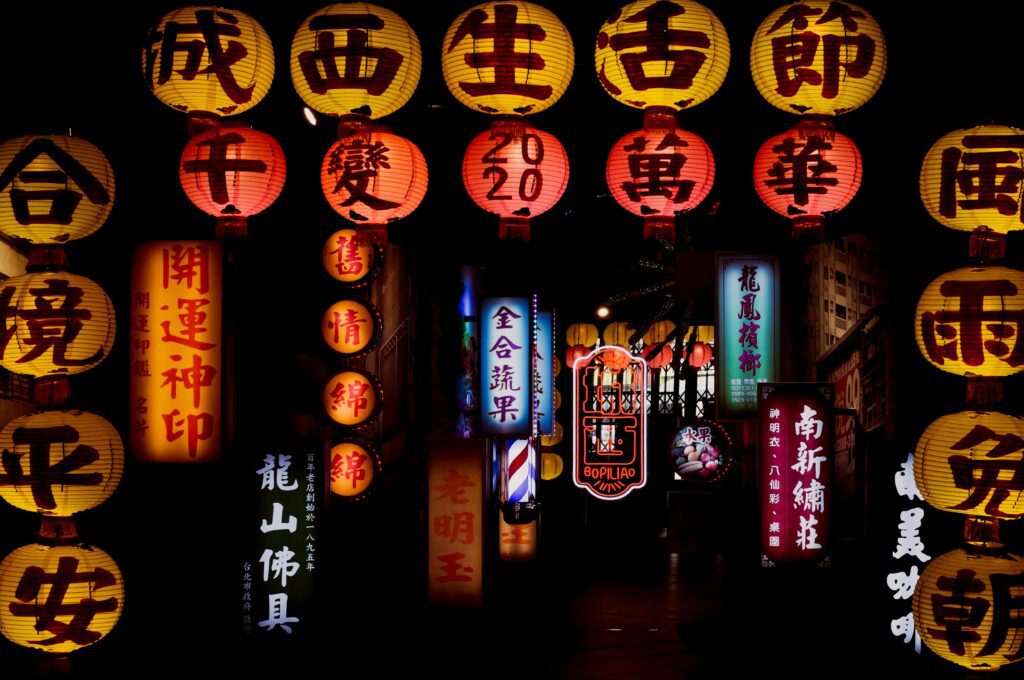 A stunning display of colorful Chinese lanterns glowing at night, creating a festive atmosphere.